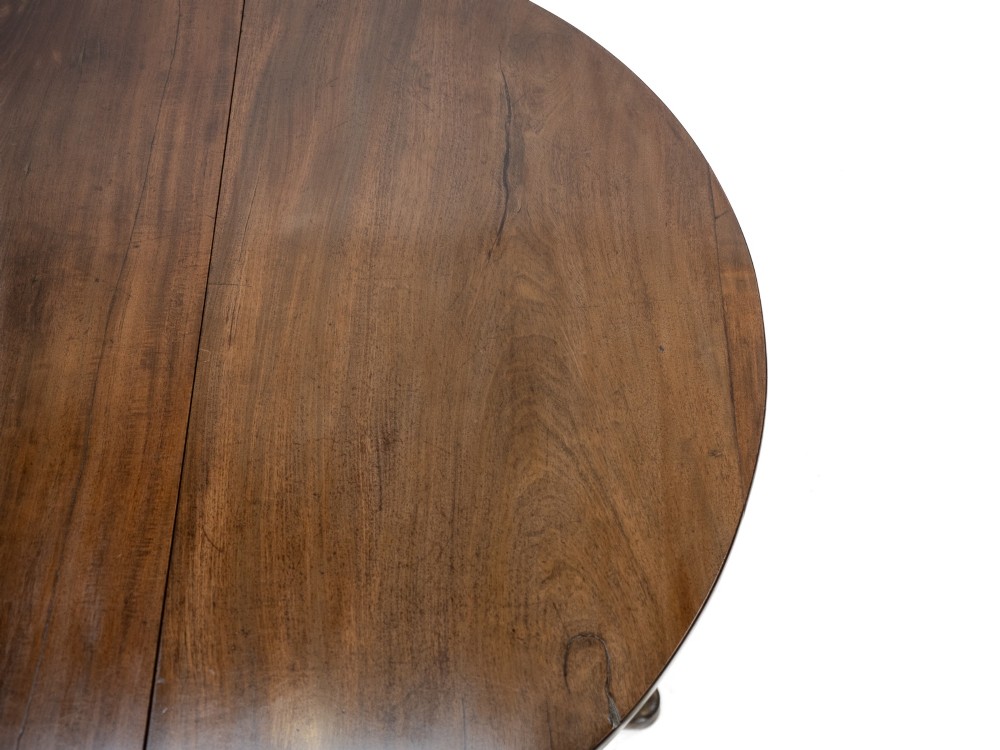 A George II mid-18th century dark mahogany oval drop-leaf table with slender legs ending in pad feet. View XII