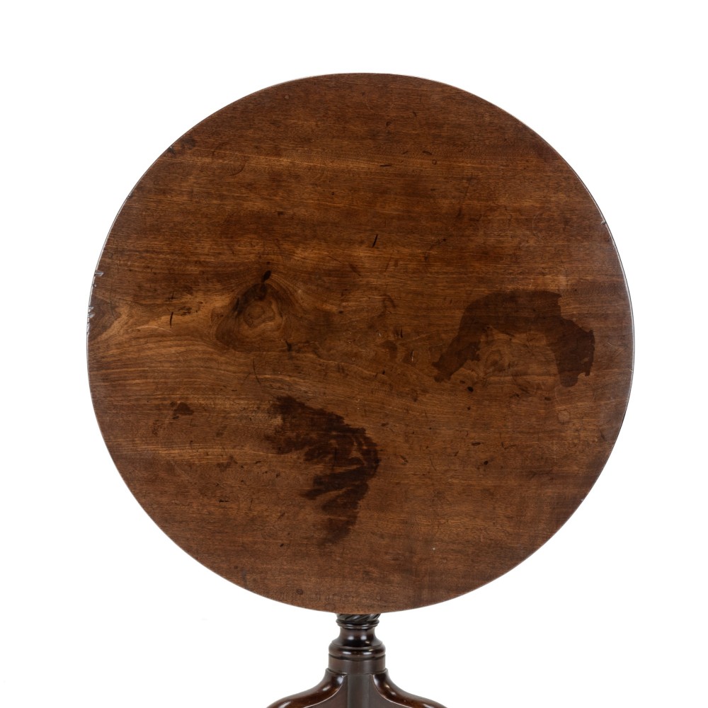 An 18th-century dark mahogany wine table with a round top, spiral-turned central column, and a tripod base with pad feet. View III