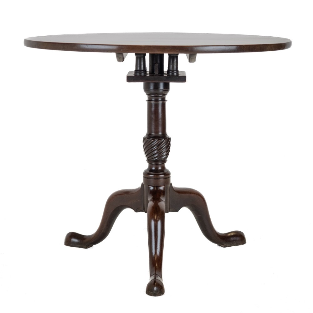 An 18th-century dark mahogany wine table with a round top, spiral-turned central column, and a tripod base with pad feet. View V