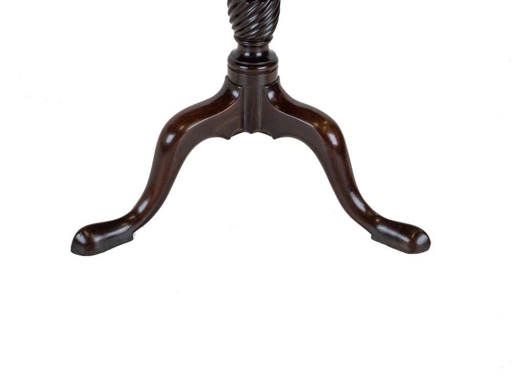 An 18th-century dark mahogany wine table with a round top, spiral-turned central column, and a tripod base with pad feet. View IX