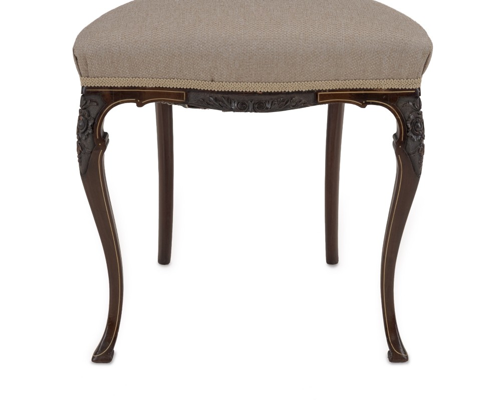 A set of four Sheraton Revival mahogany salon chairs featuring openwork heart-shaped backs with intricate carved splats, neutral upholstered seats, and cabriole front legs. View IV