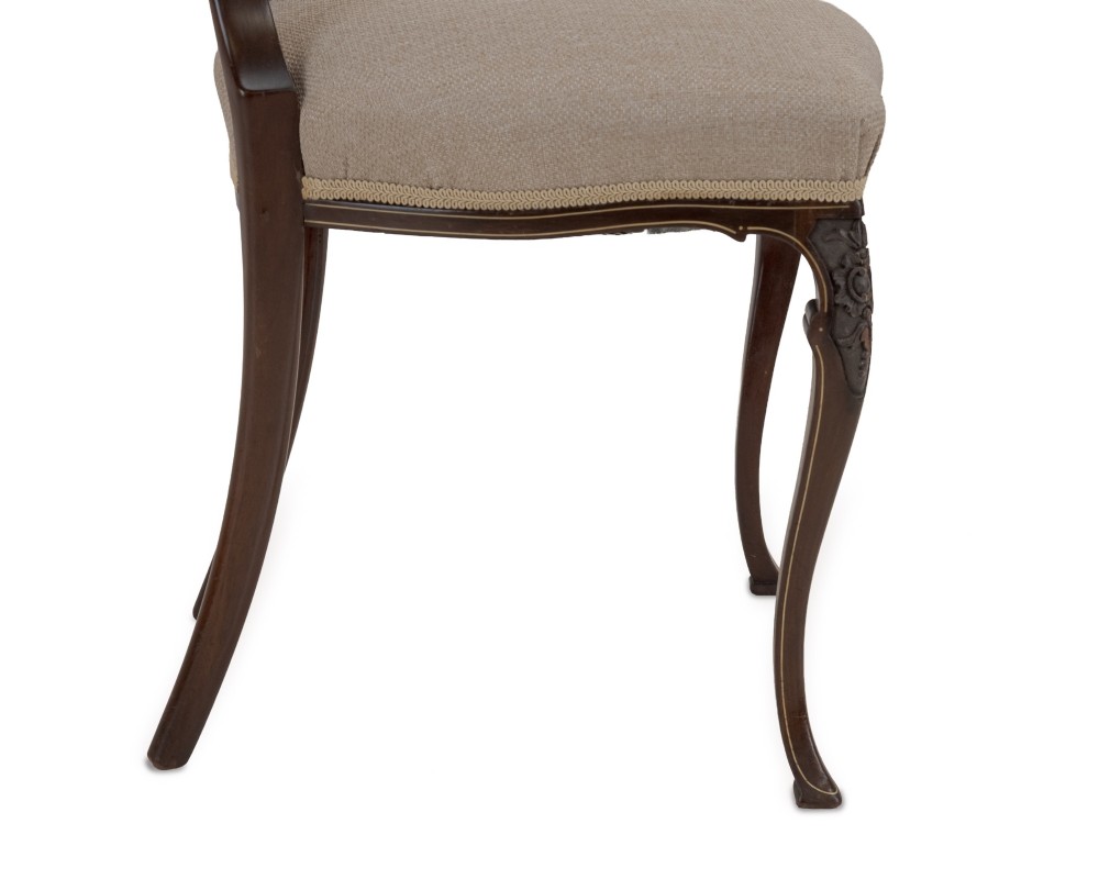 A set of four Sheraton Revival mahogany salon chairs featuring openwork heart-shaped backs with intricate carved splats, neutral upholstered seats, and cabriole front legs. View XIII
