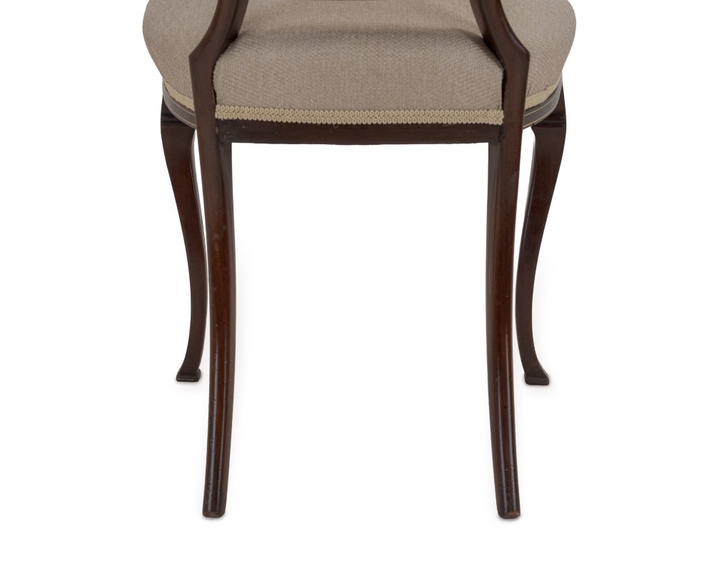 A set of four Sheraton Revival mahogany salon chairs featuring openwork heart-shaped backs with intricate carved splats, neutral upholstered seats, and cabriole front legs. View XIV