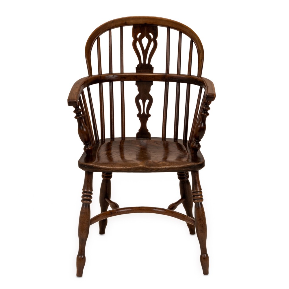 A set of six early 19th-century Windsor armchairs featuring hoop backs, pierced central splats, saddle seats, turned legs, and curved crinoline stretchers. View IV