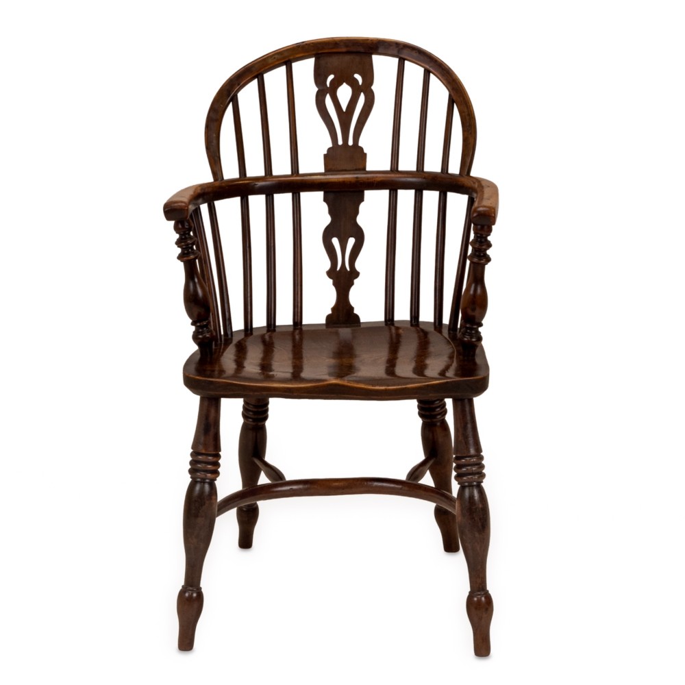 A set of six early 19th-century Windsor armchairs featuring hoop backs, pierced central splats, saddle seats, turned legs, and curved crinoline stretchers. View VII