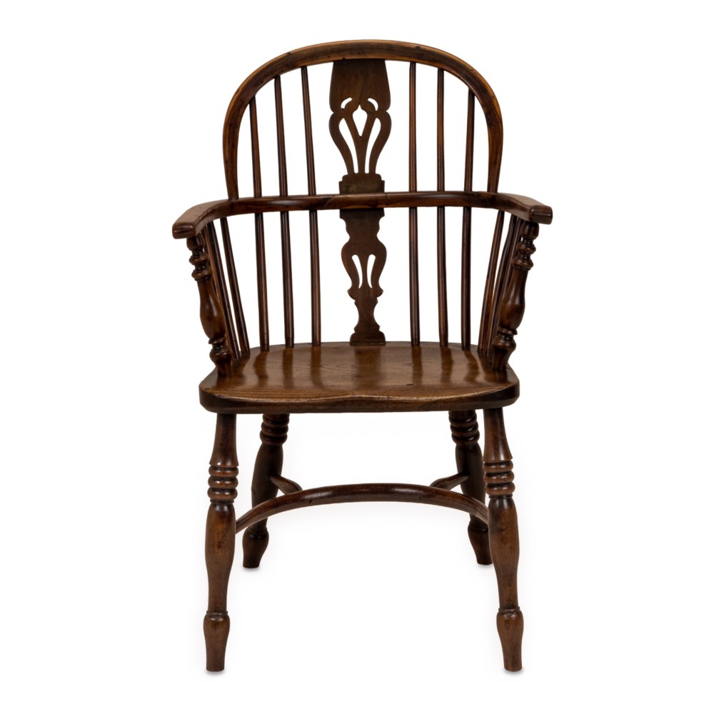 A set of six early 19th-century Windsor armchairs featuring hoop backs, pierced central splats, saddle seats, turned legs, and curved crinoline stretchers. View IX