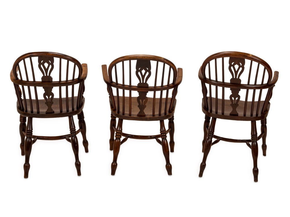 A set of six early 19th-century Windsor armchairs featuring hoop backs, pierced central splats, saddle seats, turned legs, and curved crinoline stretchers. View XI