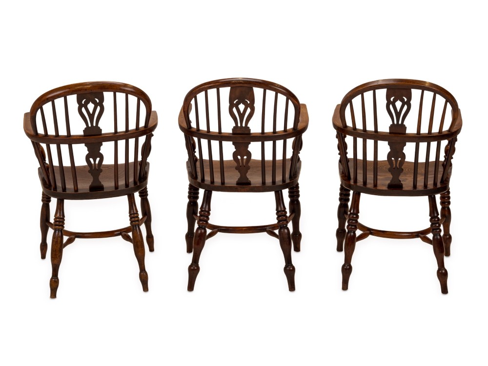A set of six early 19th-century Windsor armchairs featuring hoop backs, pierced central splats, saddle seats, turned legs, and curved crinoline stretchers. View XIV