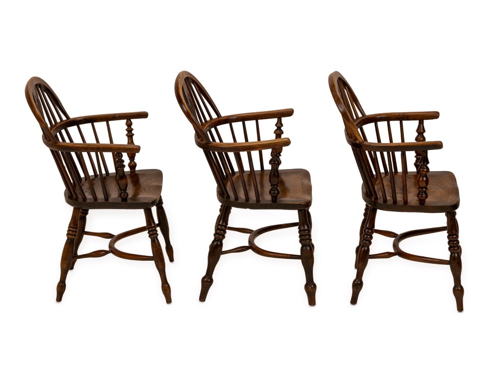 A set of six early 19th-century Windsor armchairs featuring hoop backs, pierced central splats, saddle seats, turned legs, and curved crinoline stretchers. View XV