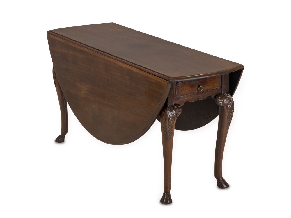 A George II Irish mahogany drop-leaf dining table with an oval top, end drawer, cabriole legs, and carved hoof feet. View II
