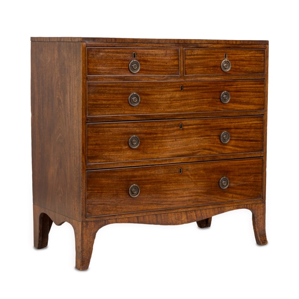 A late Georgian Regency mahogany chest of drawers featuring a caddy top, two short drawers over three long drawers, brass ring handles, and splayed bracket feet. View III