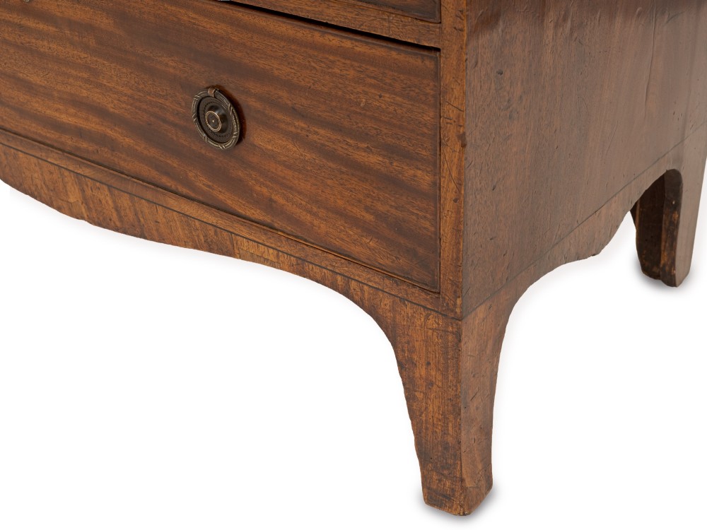 A late Georgian Regency mahogany chest of drawers featuring a caddy top, two short drawers over three long drawers, brass ring handles, and splayed bracket feet. View VII