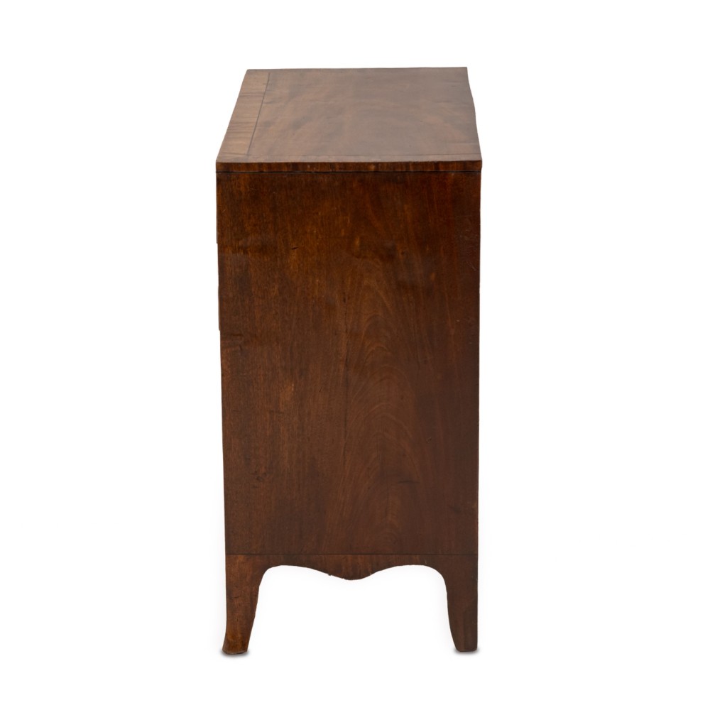 A late Georgian Regency mahogany chest of drawers featuring a caddy top, two short drawers over three long drawers, brass ring handles, and splayed bracket feet. View VIII