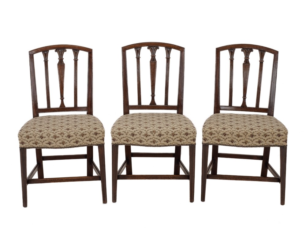 Set of six Georgian mahogany dining chairs in Sheraton style, including four side chairs and two open armchairs, with pattern upholstered seats. View II