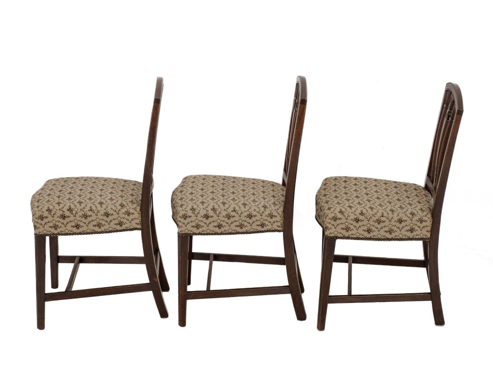 Set of six Georgian mahogany dining chairs in Sheraton style, including four side chairs and two open armchairs, with pattern upholstered seats. View III