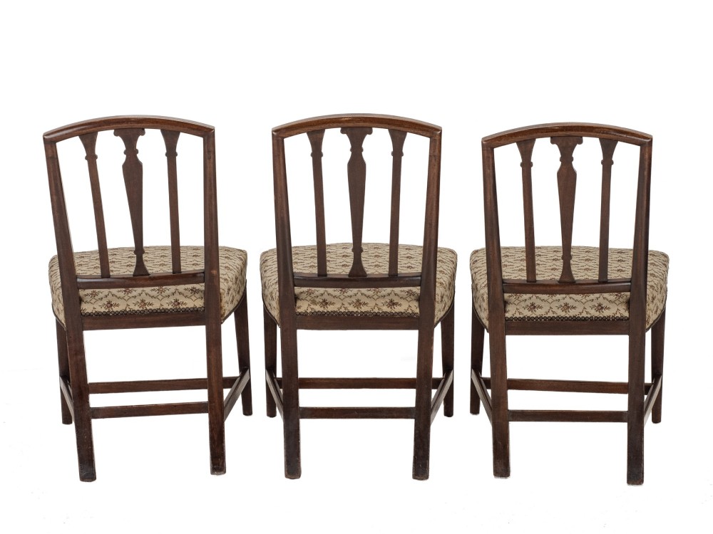 Set of six Georgian mahogany dining chairs in Sheraton style, including four side chairs and two open armchairs, with pattern upholstered seats. View IV