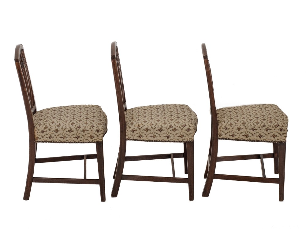 Set of six Georgian mahogany dining chairs in Sheraton style, including four side chairs and two open armchairs, with pattern upholstered seats. View V