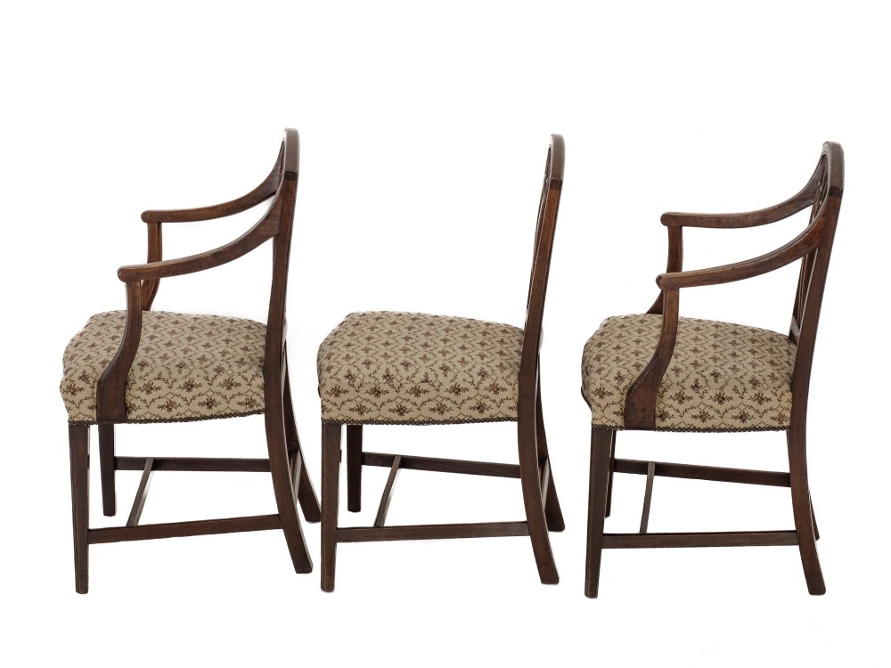 Set of six Georgian mahogany dining chairs in Sheraton style, including four side chairs and two open armchairs, with pattern upholstered seats. View VII