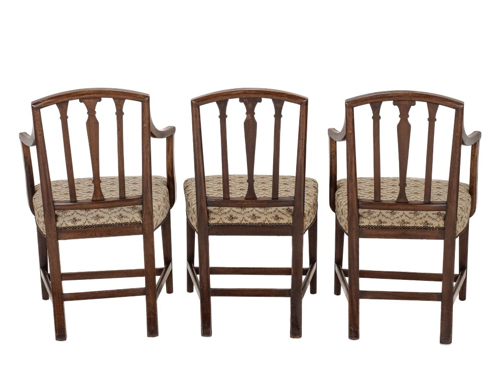 Set of six Georgian mahogany dining chairs in Sheraton style, including four side chairs and two open armchairs, with pattern upholstered seats. View VIII