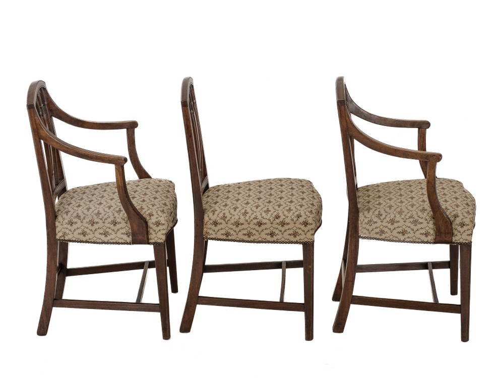Set of six Georgian mahogany dining chairs in Sheraton style, including four side chairs and two open armchairs, with pattern upholstered seats. View IX