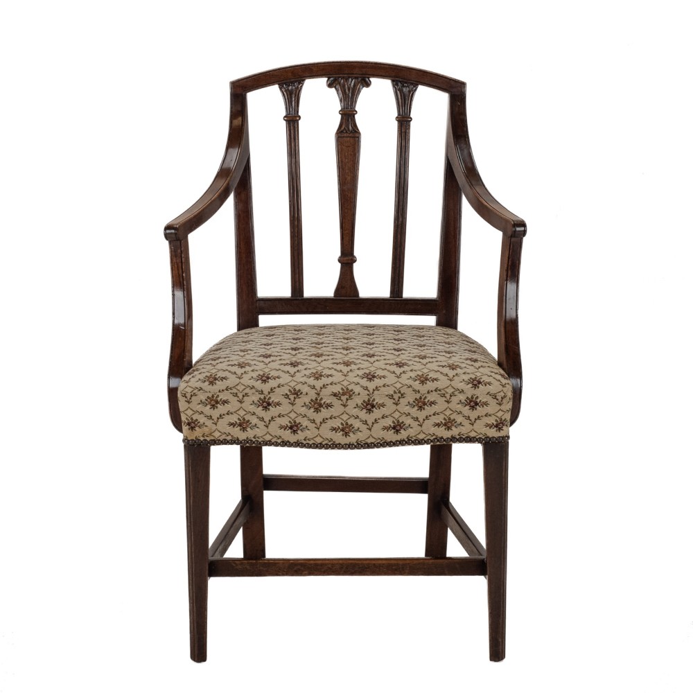 Set of six Georgian mahogany dining chairs in Sheraton style, including four side chairs and two open armchairs, with pattern upholstered seats. View XII