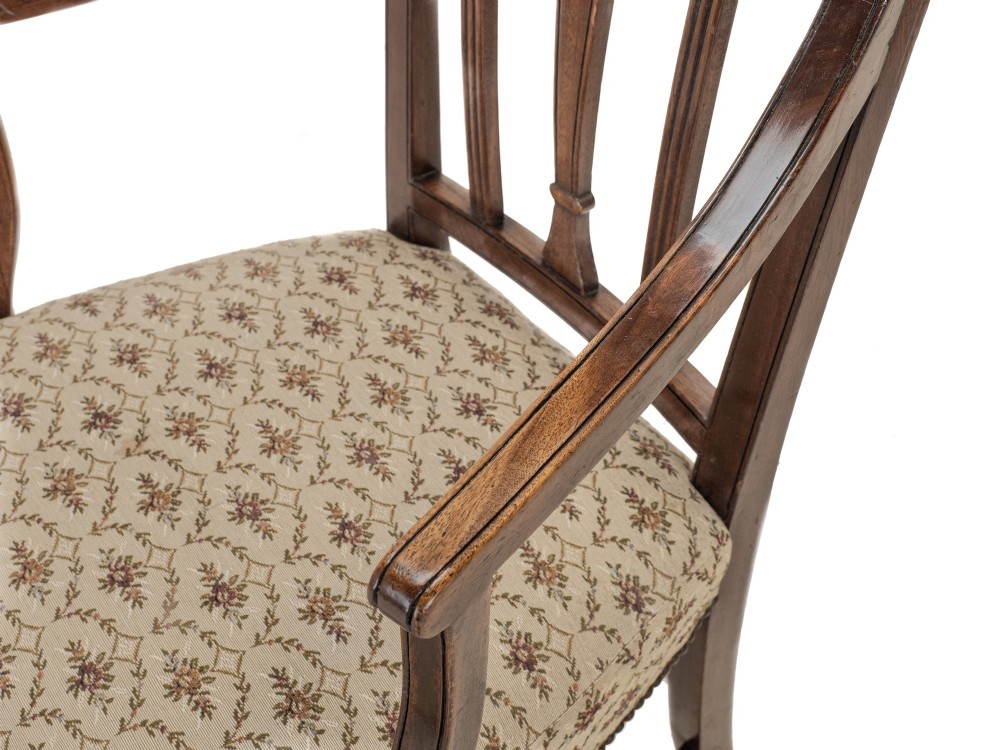 Set of six Georgian mahogany dining chairs in Sheraton style, including four side chairs and two open armchairs, with pattern upholstered seats. View XV