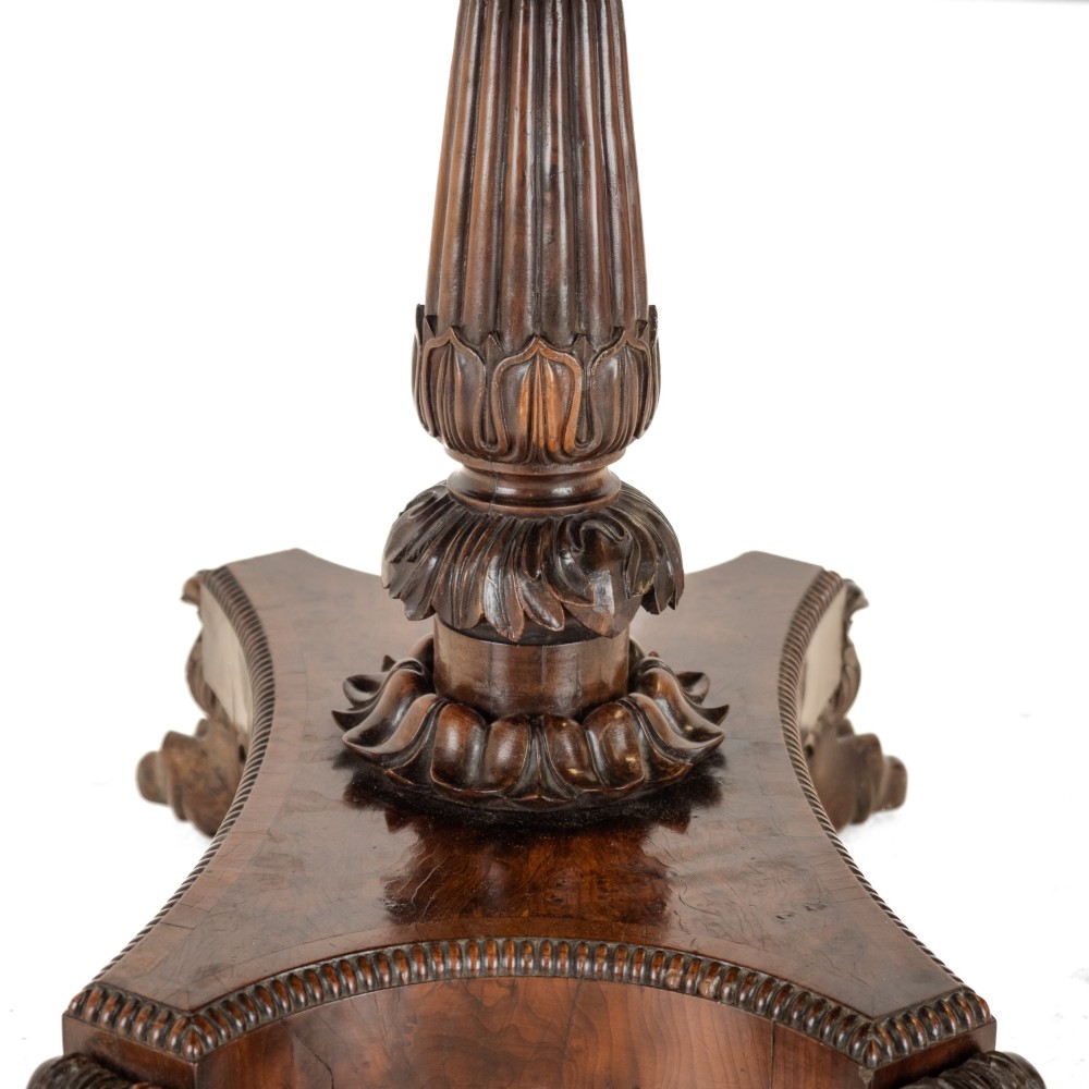An antique William IV burr yew wood card table with a fold-over top, central carved pedestal column, and paw feet. View XI