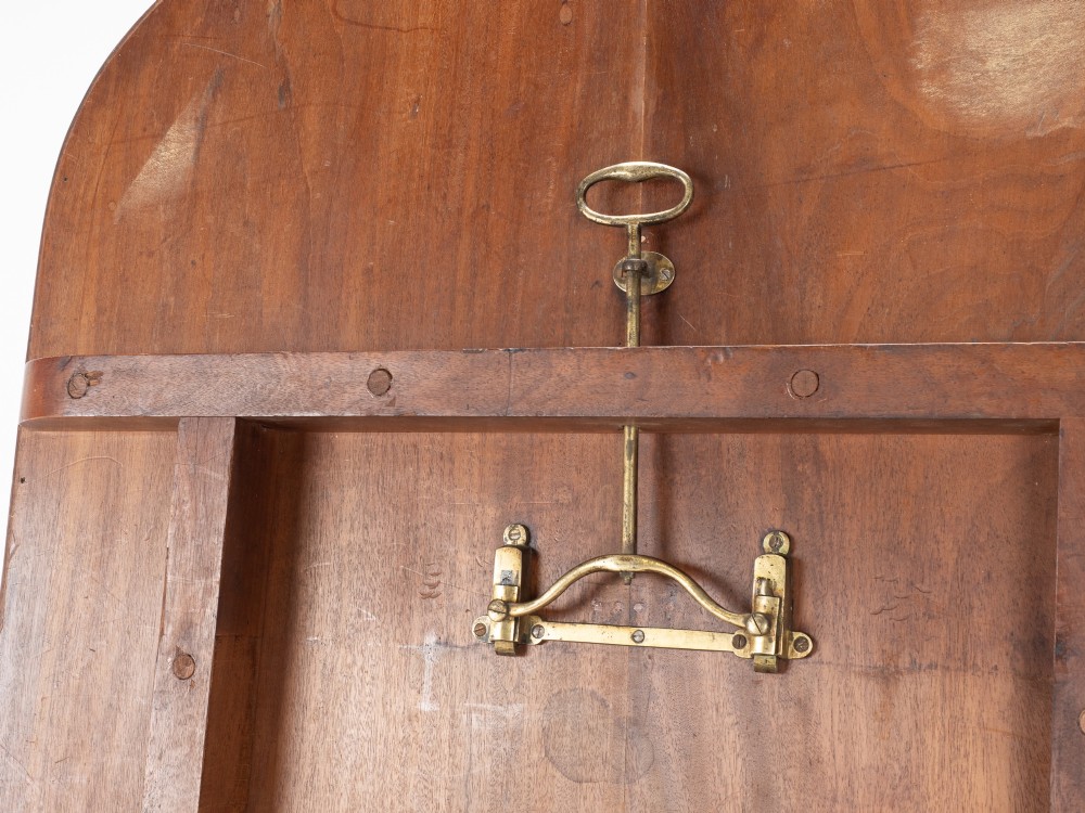 A George III mahogany dining table featuring a rectangular tilt-top surface with rounded corners set on a reeded central pedestal and four splayed legs with brass paw castors. View XIII