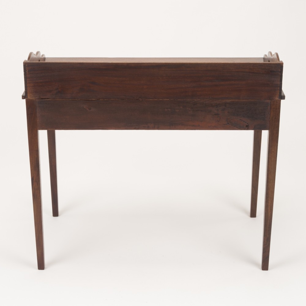 An early 19th-century mahogany tray-top writing table featuring a gallery edge with side cutout handles, two drawers with knob handles, and square tapered legs. View IX