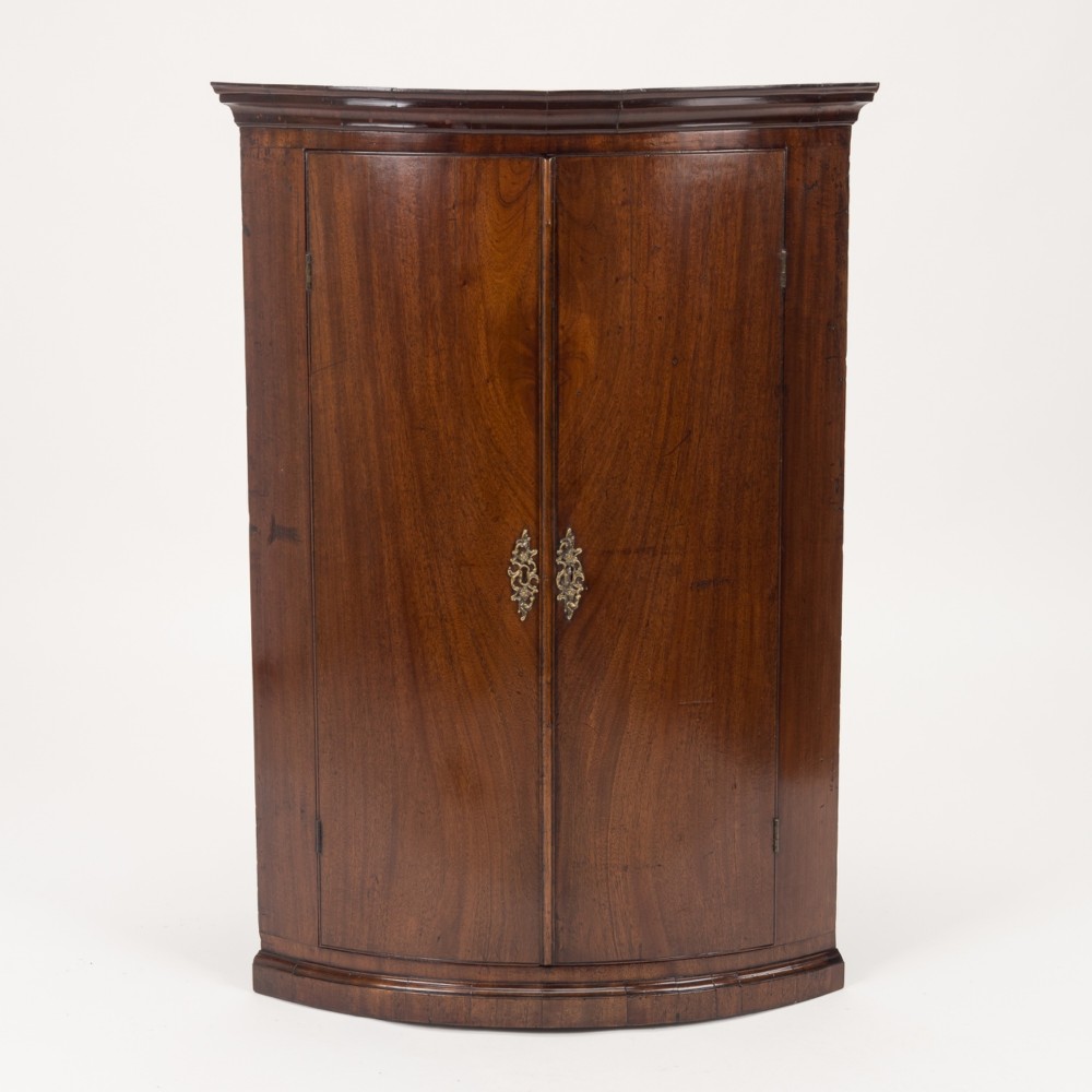 George III Mahogany Bow-Front Hanging Corner Cupboard with Spice Drawers, c.1760–1780