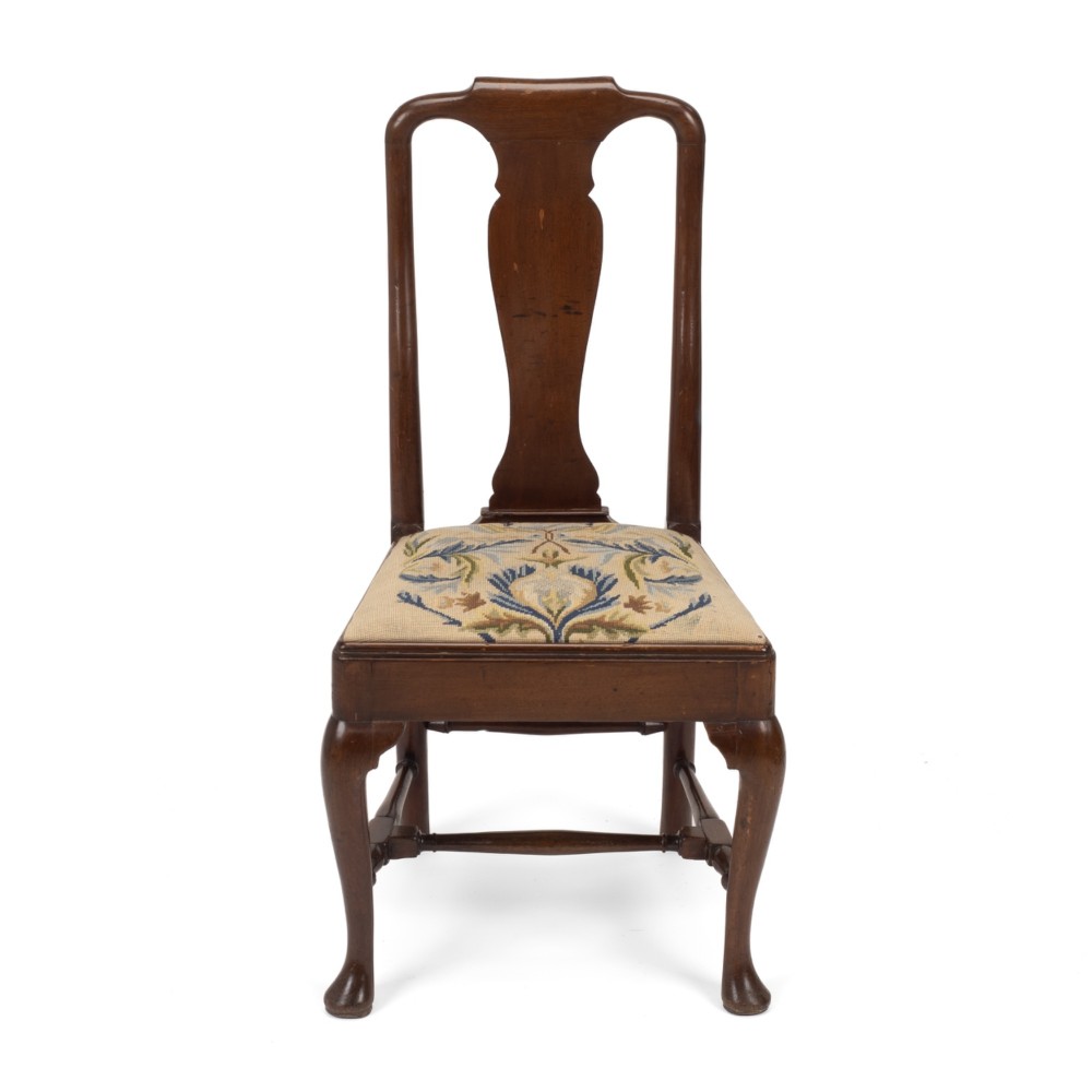 A George II walnut side chair featuring a shaped vasiform splat, cabriole front legs with pad feet, turned stretchers, and a floral needlework drop-in seat. View II