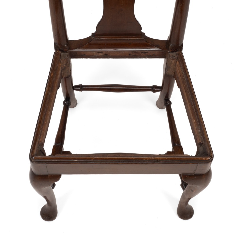 A George II walnut side chair featuring a shaped vasiform splat, cabriole front legs with pad feet, turned stretchers, and a floral needlework drop-in seat. View XI