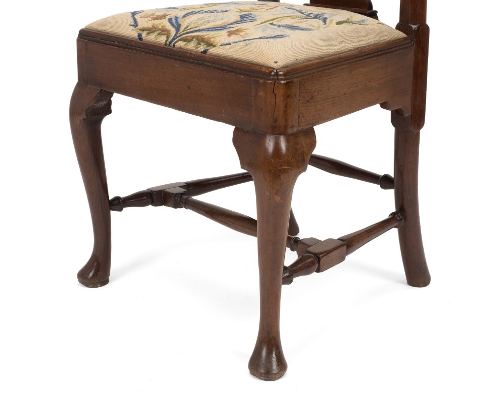 A George II walnut side chair featuring a shaped vasiform splat, cabriole front legs with pad feet, turned stretchers, and a floral needlework drop-in seat. View XII
