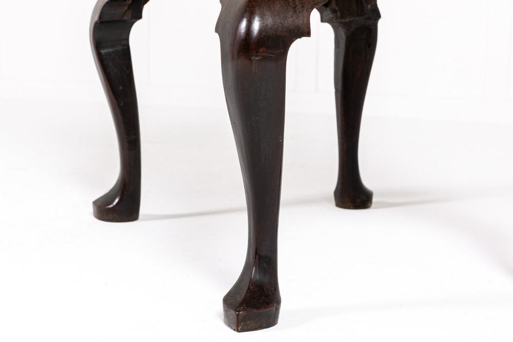 A George II mahogany lowboy featuring three drawers, brass backplate handles, a shaped apron, and four cabriole legs with pad feet. View VIII