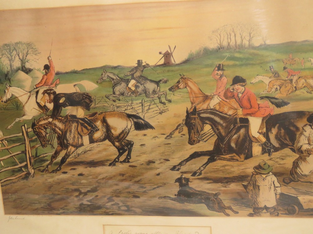 A framed Victorian sporting print depicting equestrian riders and foxhounds in a rural landscape with a windmill in the background, set within a cream mount and black wooden frame. View III