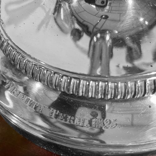 fig 2. A silver-plated Regency three-light candelabrum featuring reeded curved branches, beaded rims, and a tapered central column resting on a circular stepped base.
