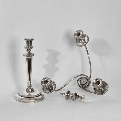 fig 3. A silver-plated Regency three-light candelabrum featuring reeded curved branches, beaded rims, and a tapered central column resting on a circular stepped base.