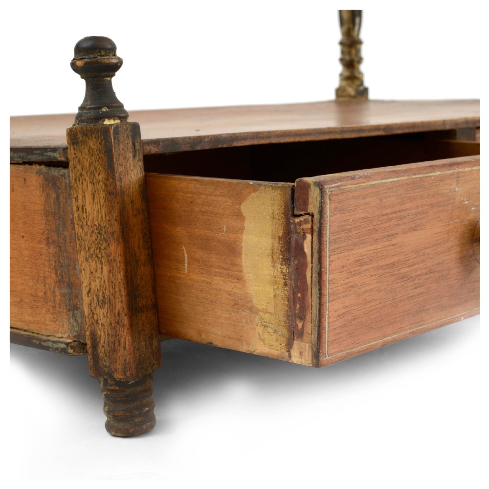 A Regency mahogany tabletop shelving unit with three graduated open tiers supported by turned spindles over a base with two drawers. View III