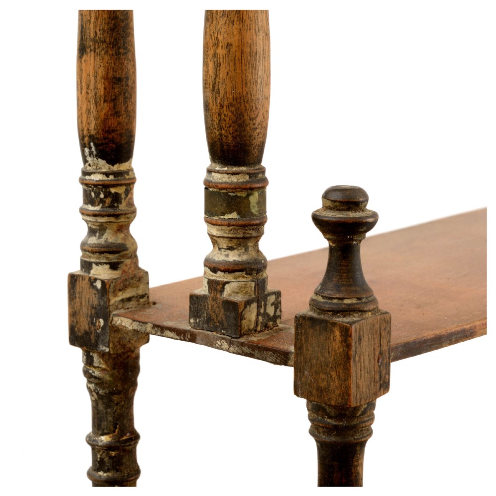 A Regency mahogany tabletop shelving unit with three graduated open tiers supported by turned spindles over a base with two drawers. View V