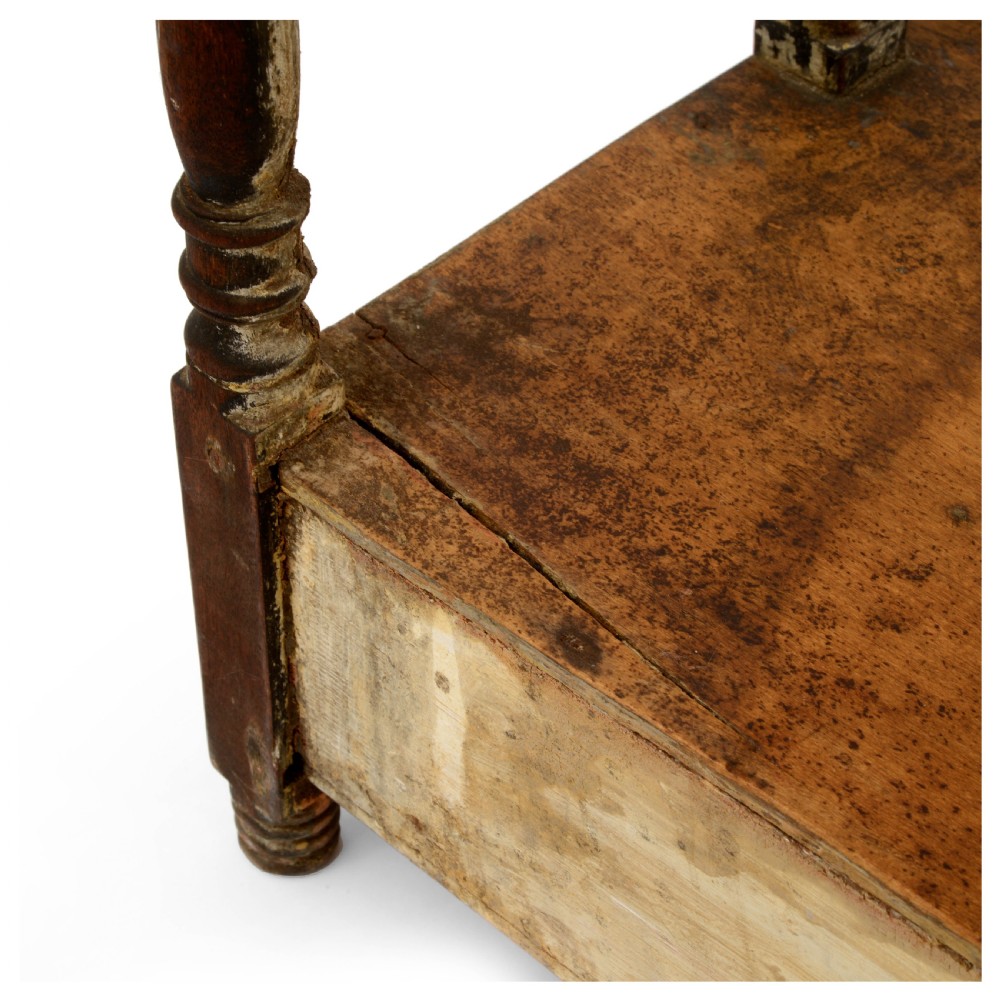 A Regency mahogany tabletop shelving unit with three graduated open tiers supported by turned spindles over a base with two drawers. View X