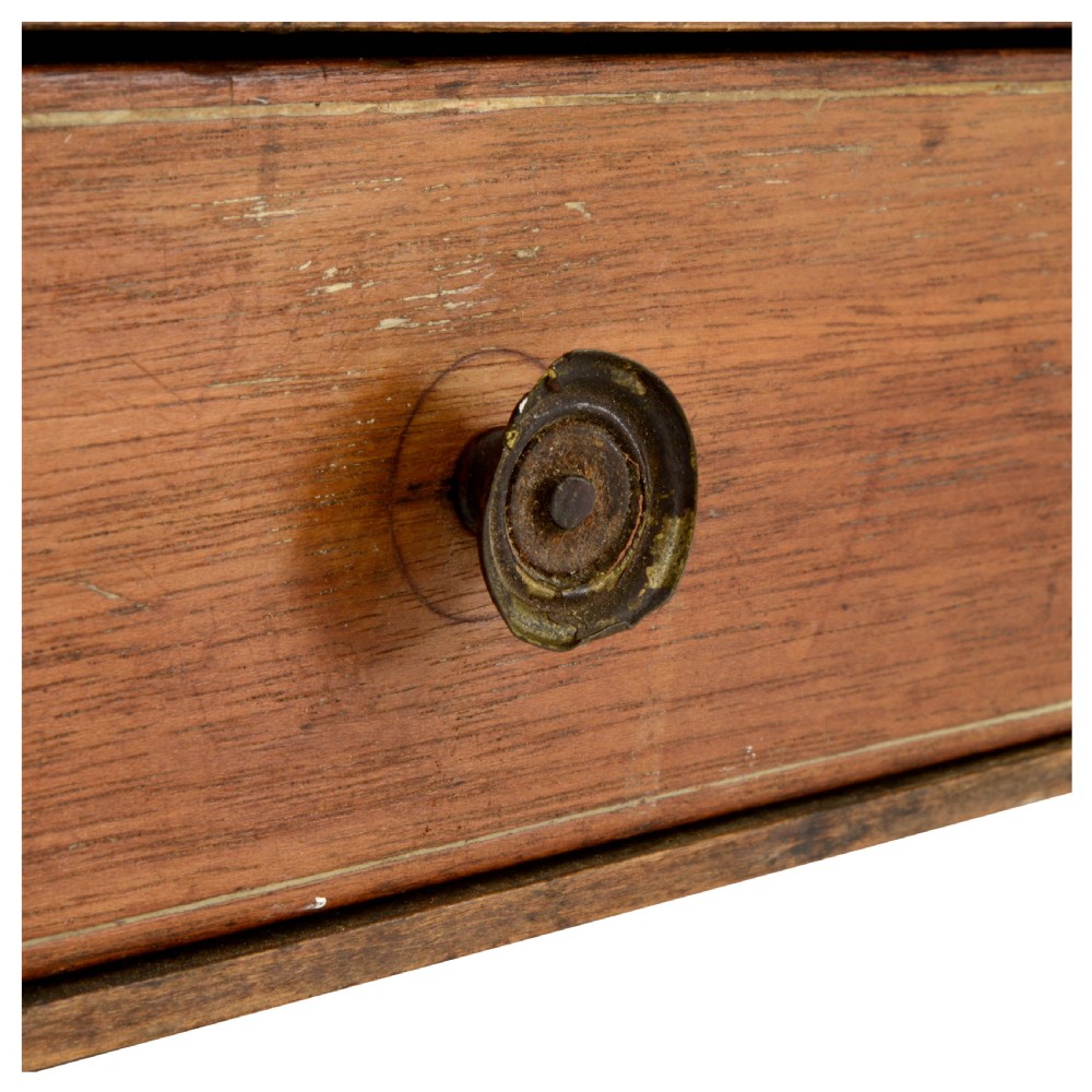 A Regency mahogany tabletop shelving unit with three graduated open tiers supported by turned spindles over a base with two drawers. View XI