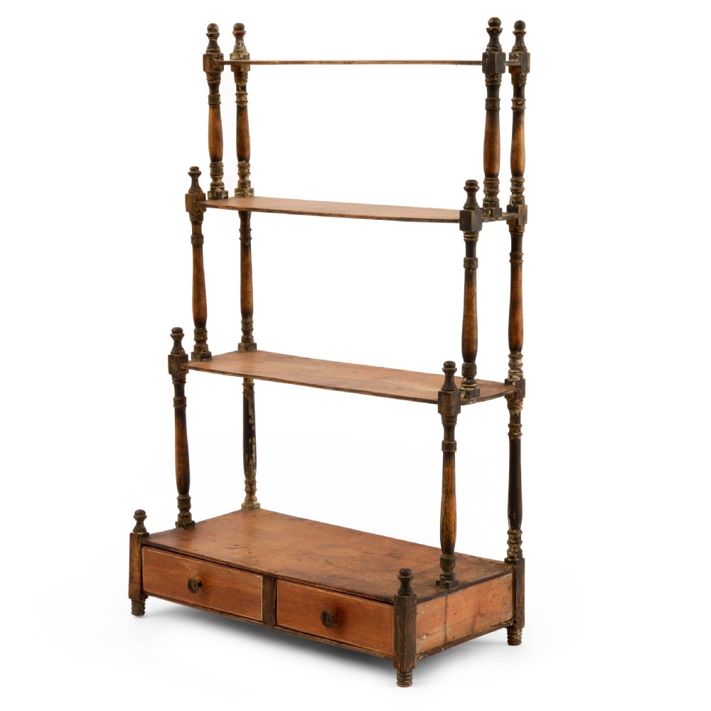 A Regency mahogany tabletop shelving unit with three graduated open tiers supported by turned spindles over a base with two drawers. View XIII