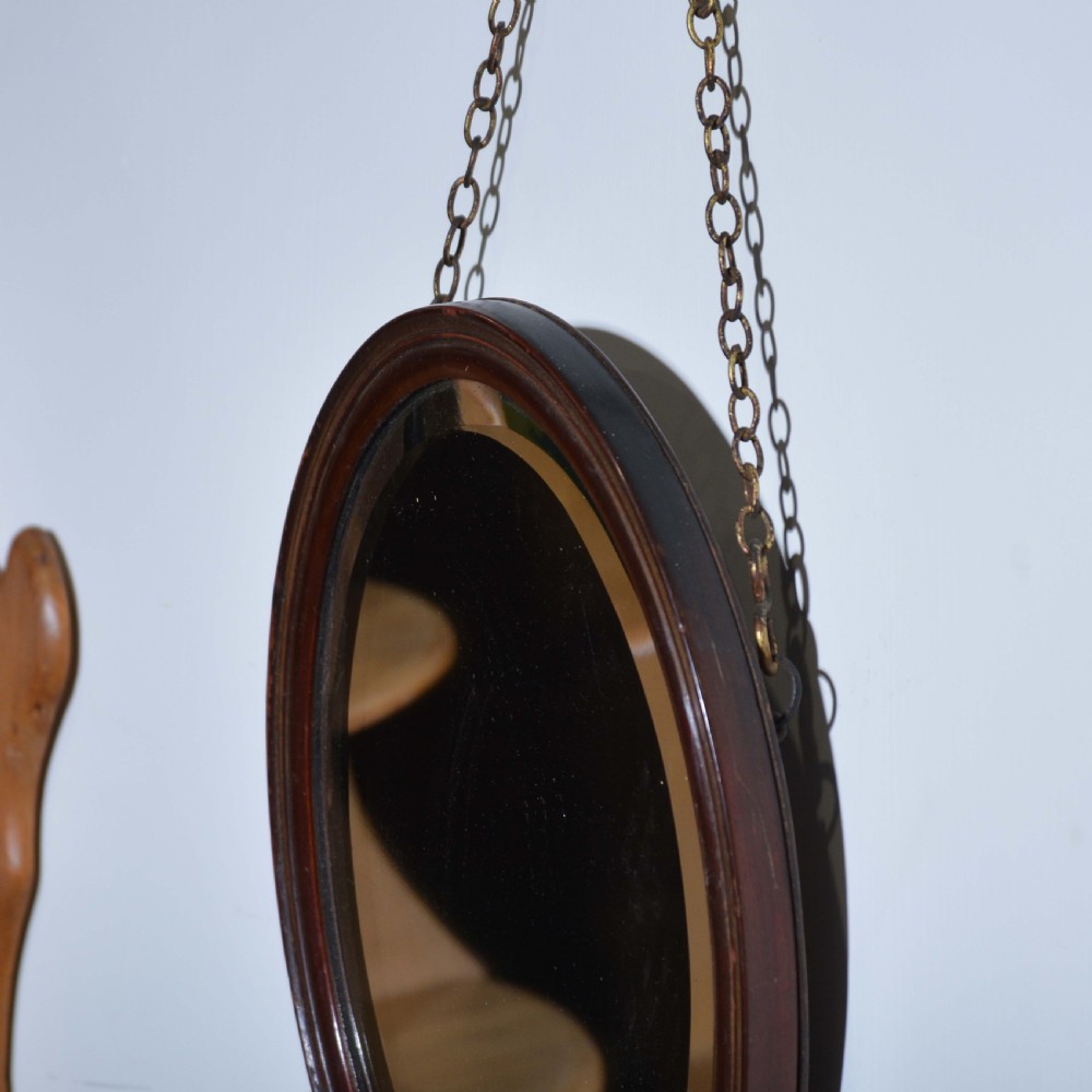 Small red lacquered oval mirror with bevelled edge View IV