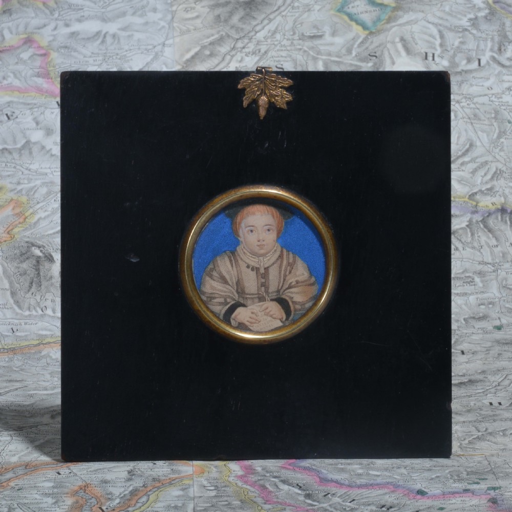 A pair of square ebonised framed portrait miniatures featuring Tudor figures in oval gilt bezels topped with brass acorn hangers. View VI