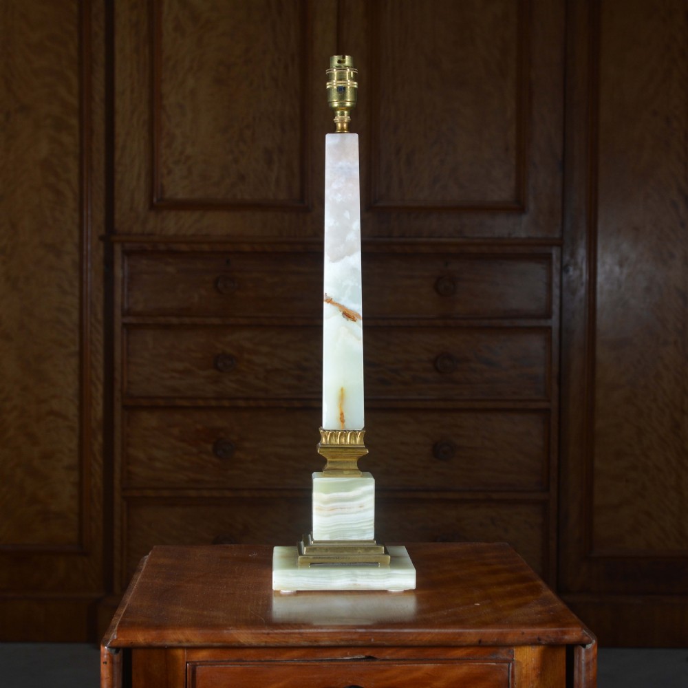 A tapered pale green onyx column table lamp featuring gilt brass collar details and a black fabric lamp shade. View III
