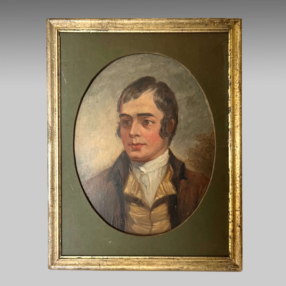 A rectangular gilded framed oil painting featuring a bust-length portrait of a man set within an oval mount.