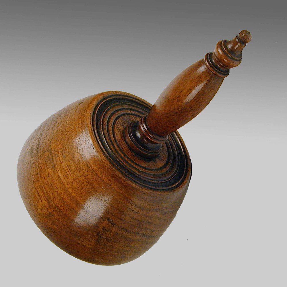 A 19th-century turned fruitwood ceremonial masons mallet with a smooth domed base, concentric circular groove details, and a turned wooden handle. View II