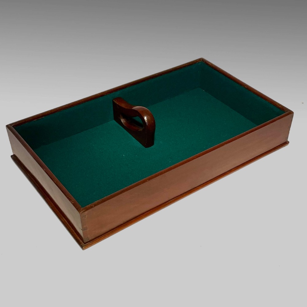 A rectangular Georgian mahogany tray lined with green baize fabric featuring a central cutout carrying handle and hand-cut dovetail joints. View II