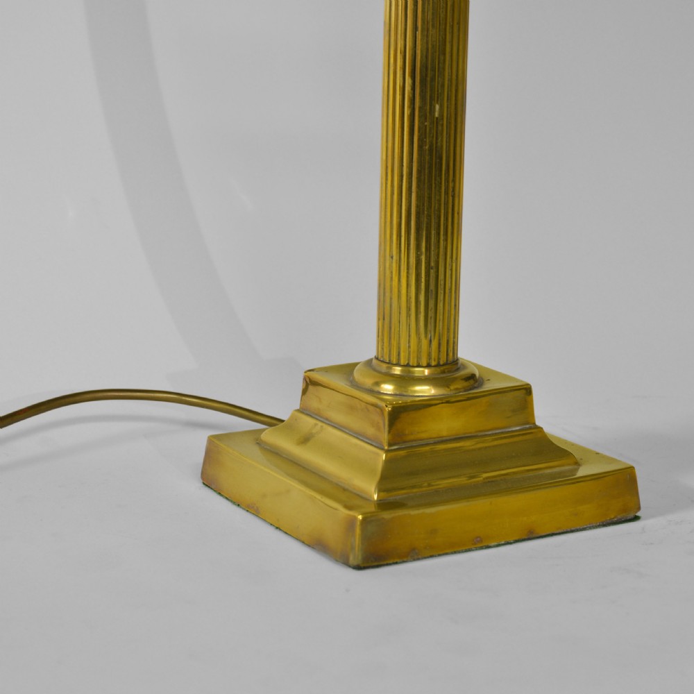 A fluted brass column table lamp base standing on a stepped square pedestal base. View II