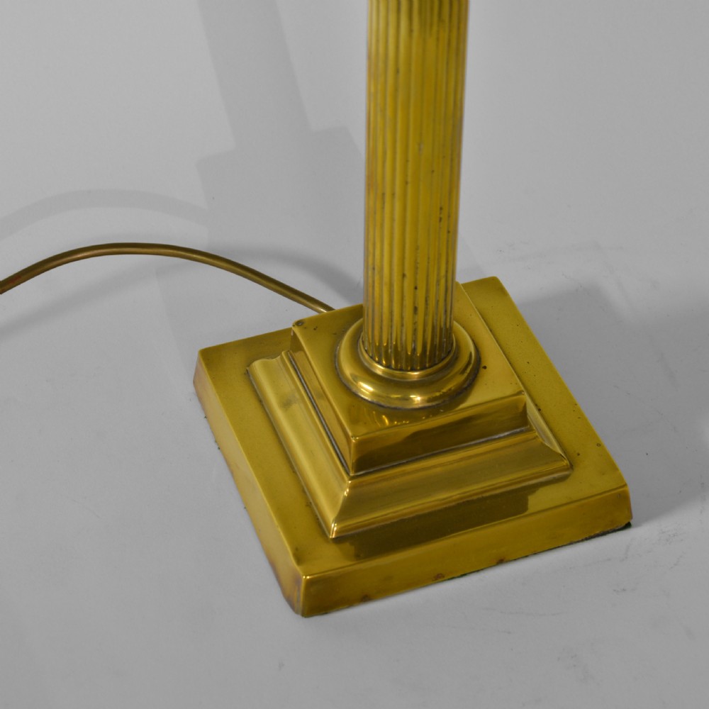 A fluted brass column table lamp base standing on a stepped square pedestal base. View III